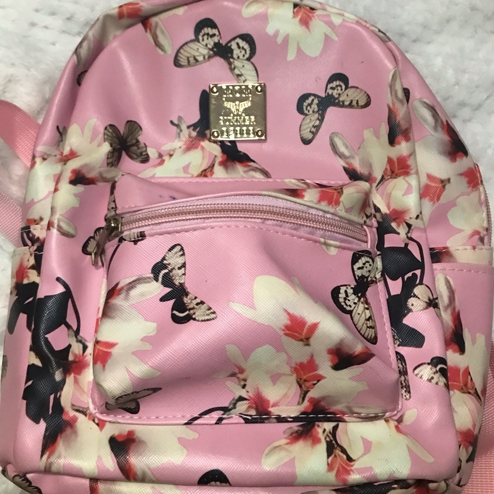 Pink mini backpack with butterfly’s and flowers